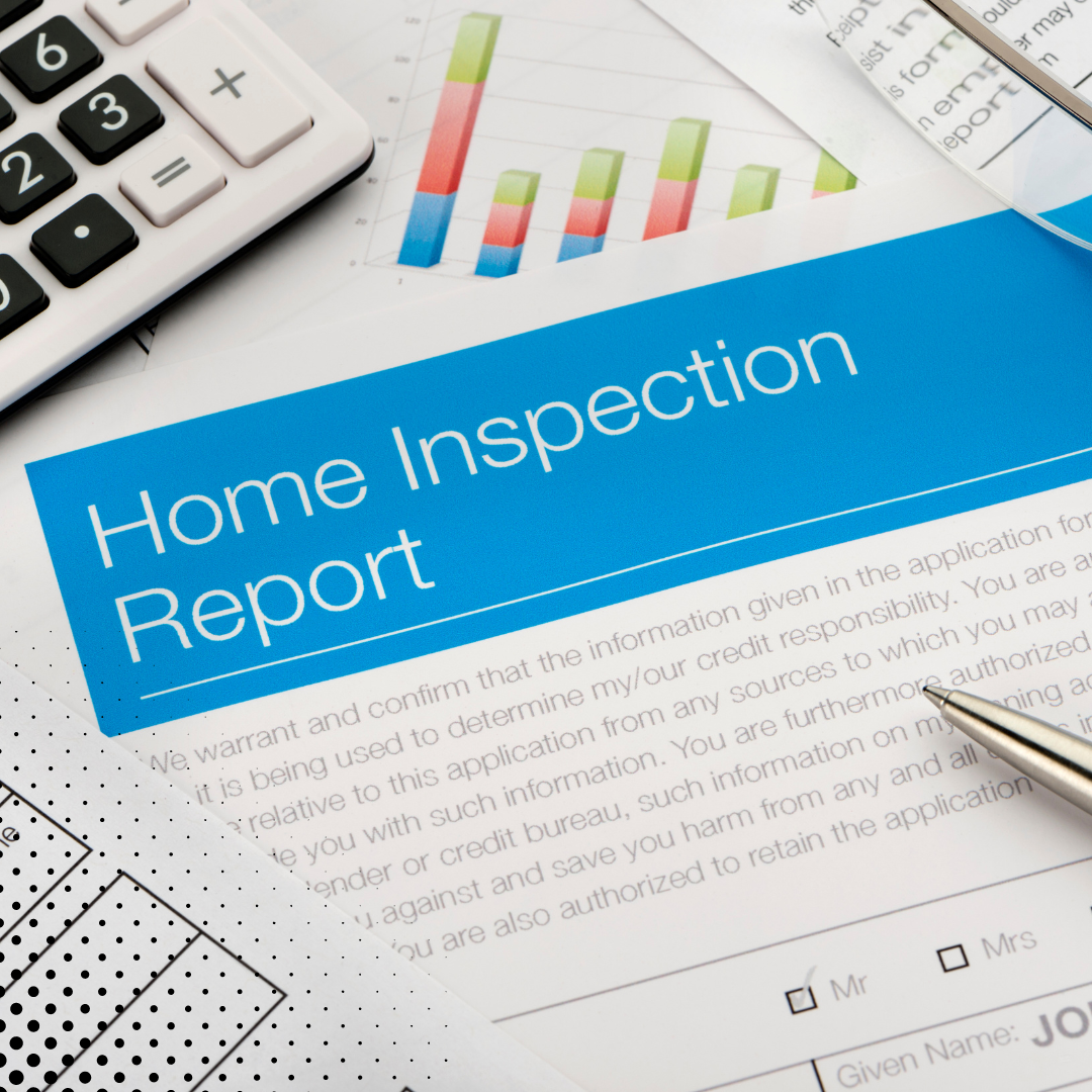 A "Home Inspection Report" placed with a calculator, pen, and financial documents.