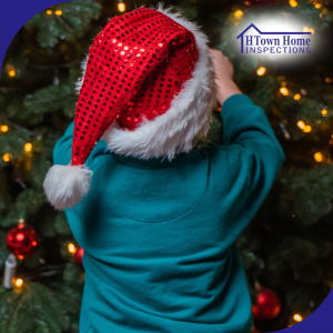 A young child wearing a festive red Santa hat