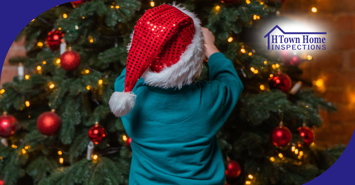 A young child wearing a festive red Santa hat