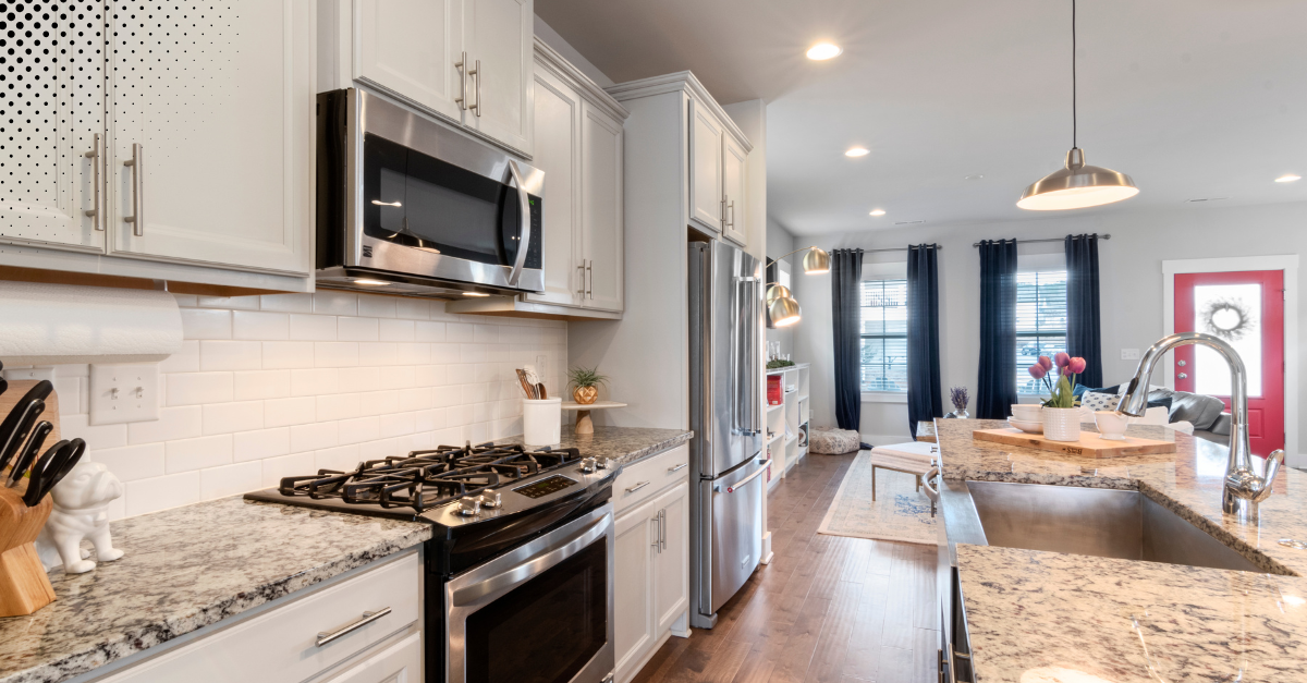 A modern kitchen with sleek appliances and granite countertops.