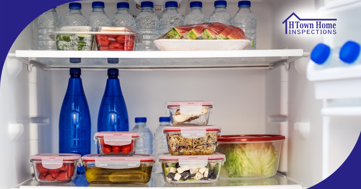 Refrigerator stocked with water bottles, fruits, and meals in food containers.