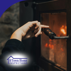 Hands opening and tending to a wood-burning stove with fire inside.