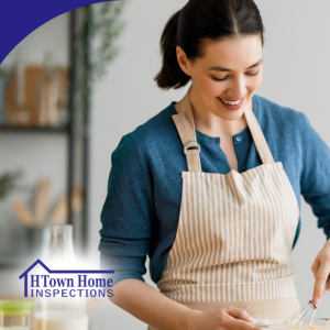 Woman smiling while whisking ingredients in a bowl in a bright kitchen.