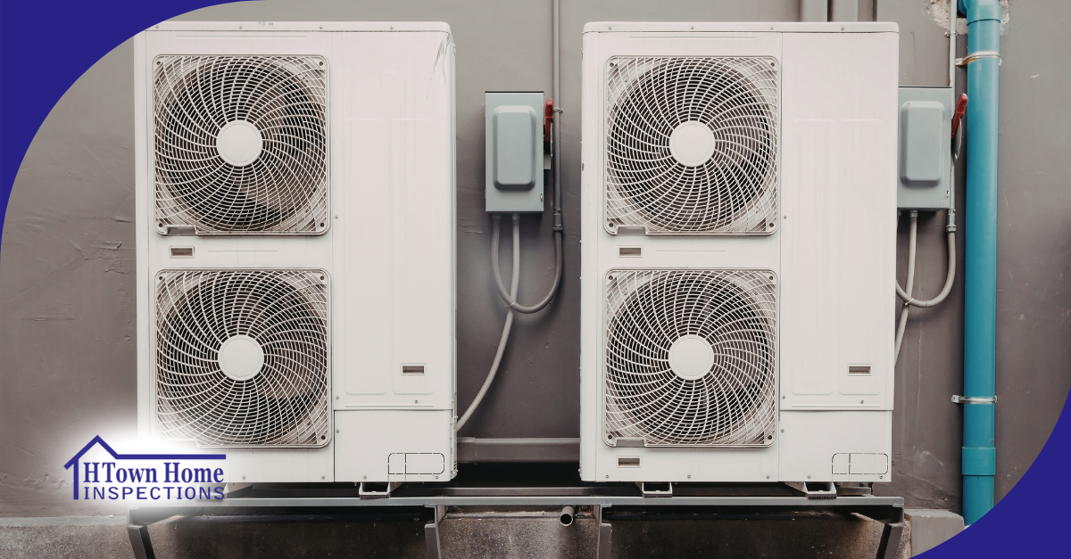 Commercial air conditioning units mounted on building exterior.